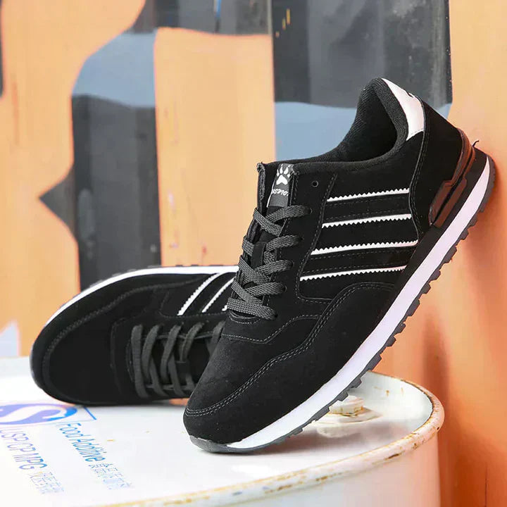 Miesten klassiset harmaat, mustat ja siniset nahkasneakersit, eleganteilla yksityiskohdilla ja mukavalla istuvuudella.