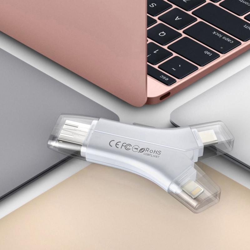 "Monikäyttöinen 4-in-1 kannettava kortinlukija; pieni musta laite neljällä liittimellä; täydellinen älylaitteille."