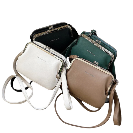 Mustan keinonahkaisen naisten käsilaukun elegantti muotoilu, käytännöllinen leike ja tilava sisus arkeen ja juhliin.